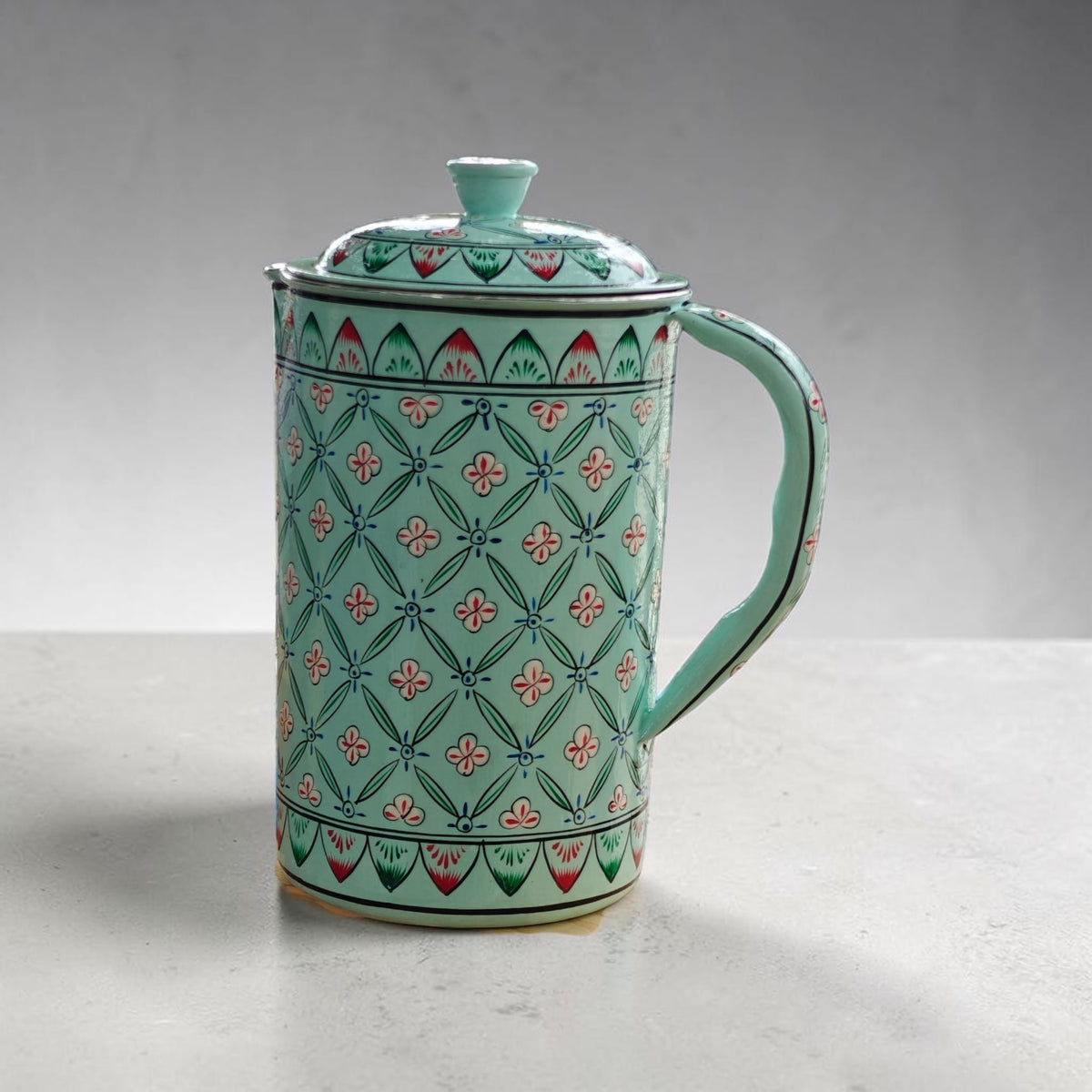 Hand-painted geometric floral water jug in light teal