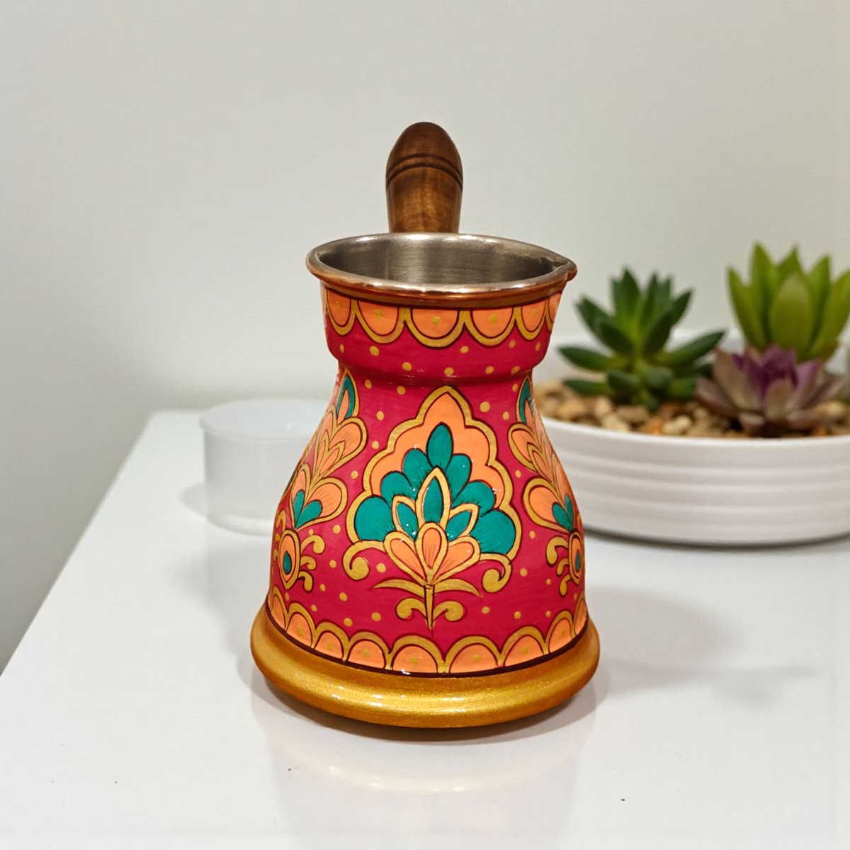 front view of the traditional hand-painted copper Turkish coffee pot with wooden handle fuschia cezve 400ml arabian floral motifs design by Dastkaari