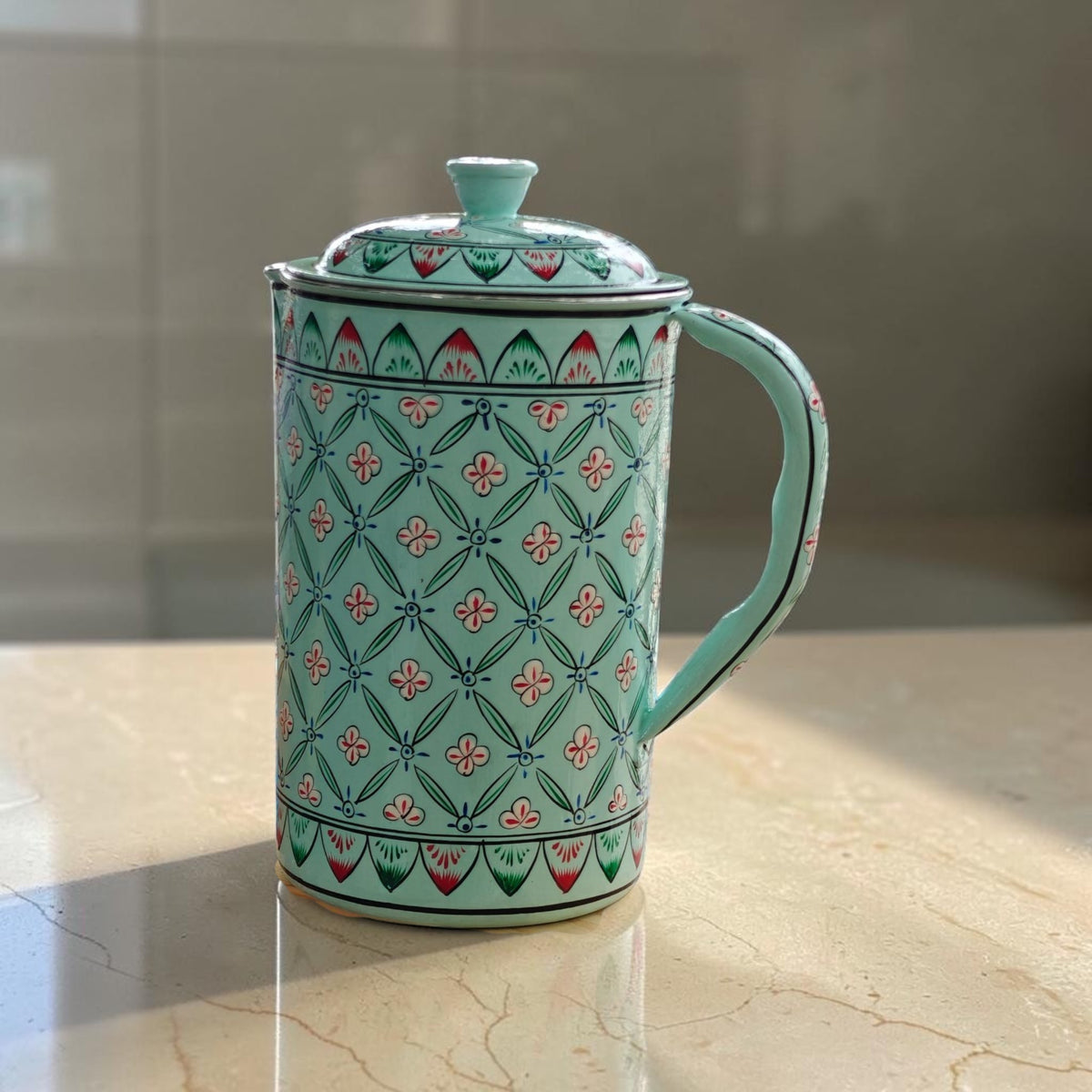 Hand-painted floral water jug in light blue