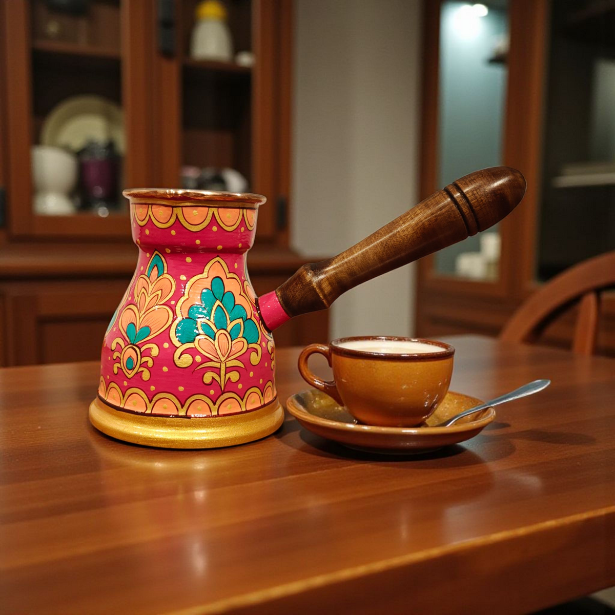Side view of the traditional hand-painted copper Turkish coffee pot with wooden handle fuschia cezve 400ml arabian design by Dastkaari